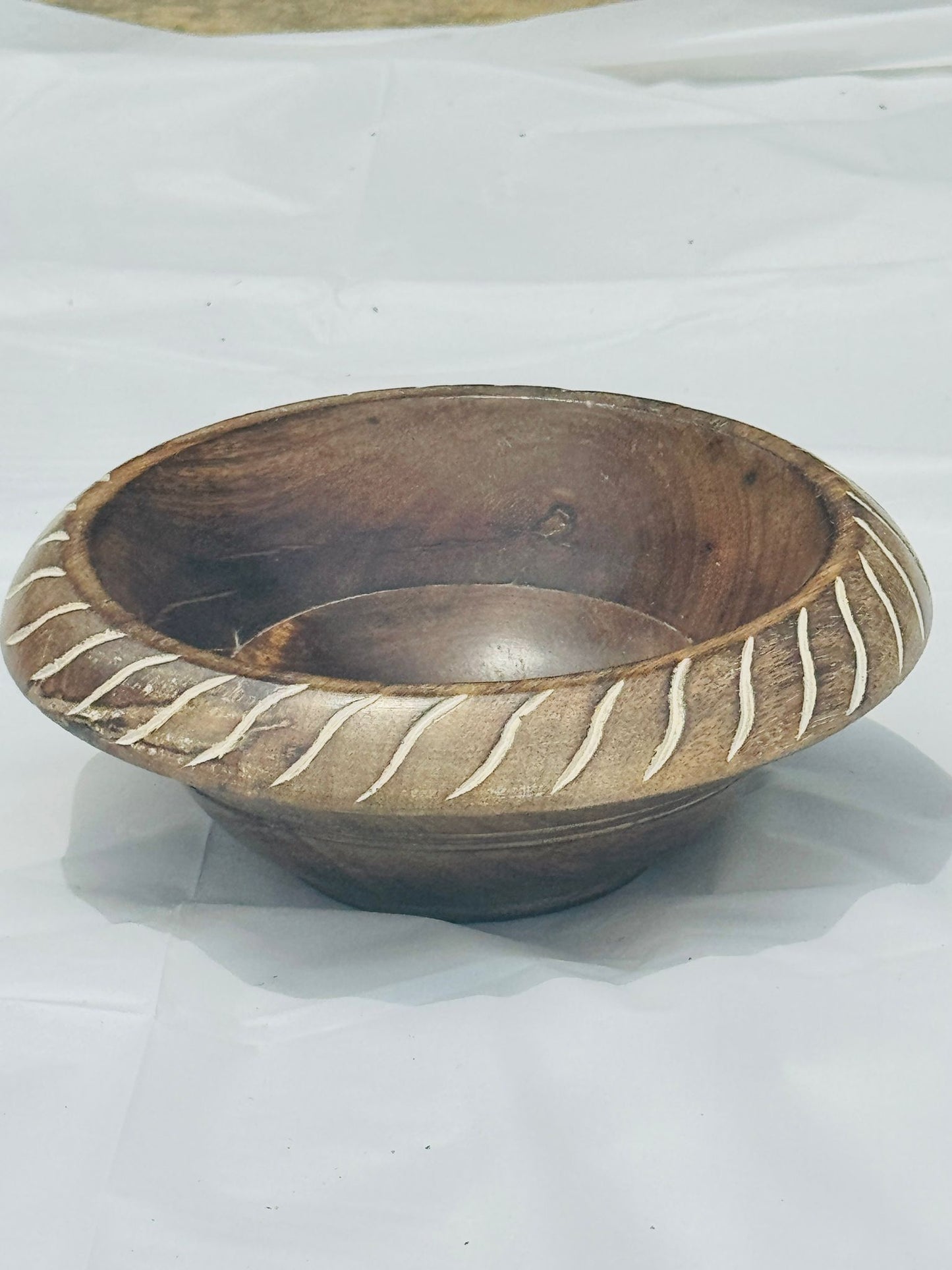 Handcrafted Wooden Bowl with Carved Rim